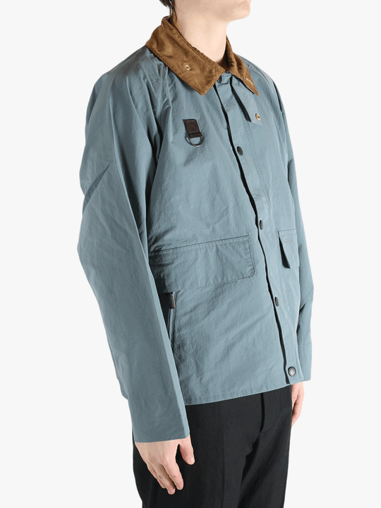 Blue jacket worn by a person, showing the jacket fit