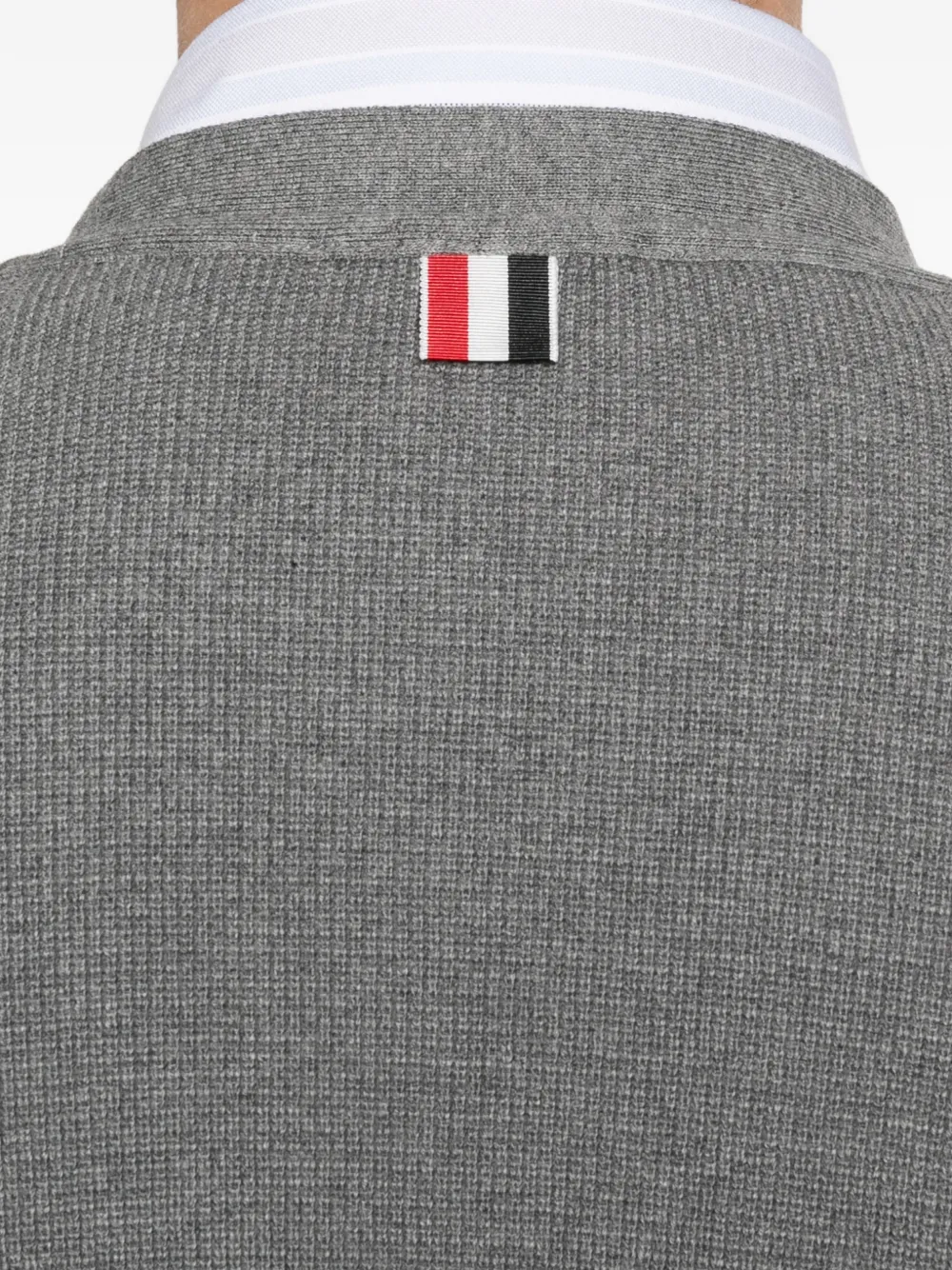 Close up of grey cardigan,showing texture of the cotton fabric