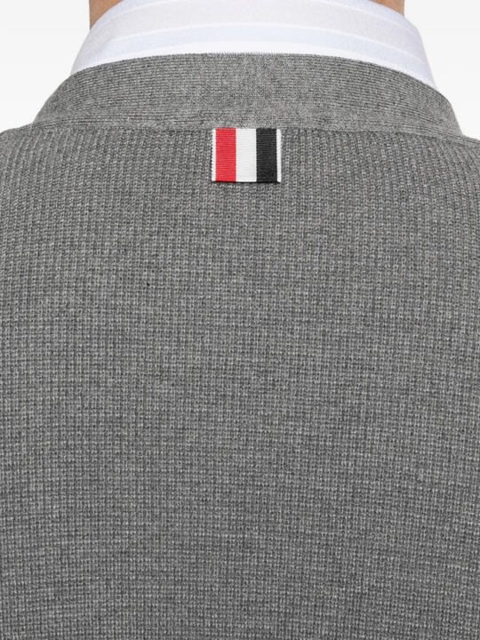 Close up of grey cardigan,showing texture of the cotton fabric