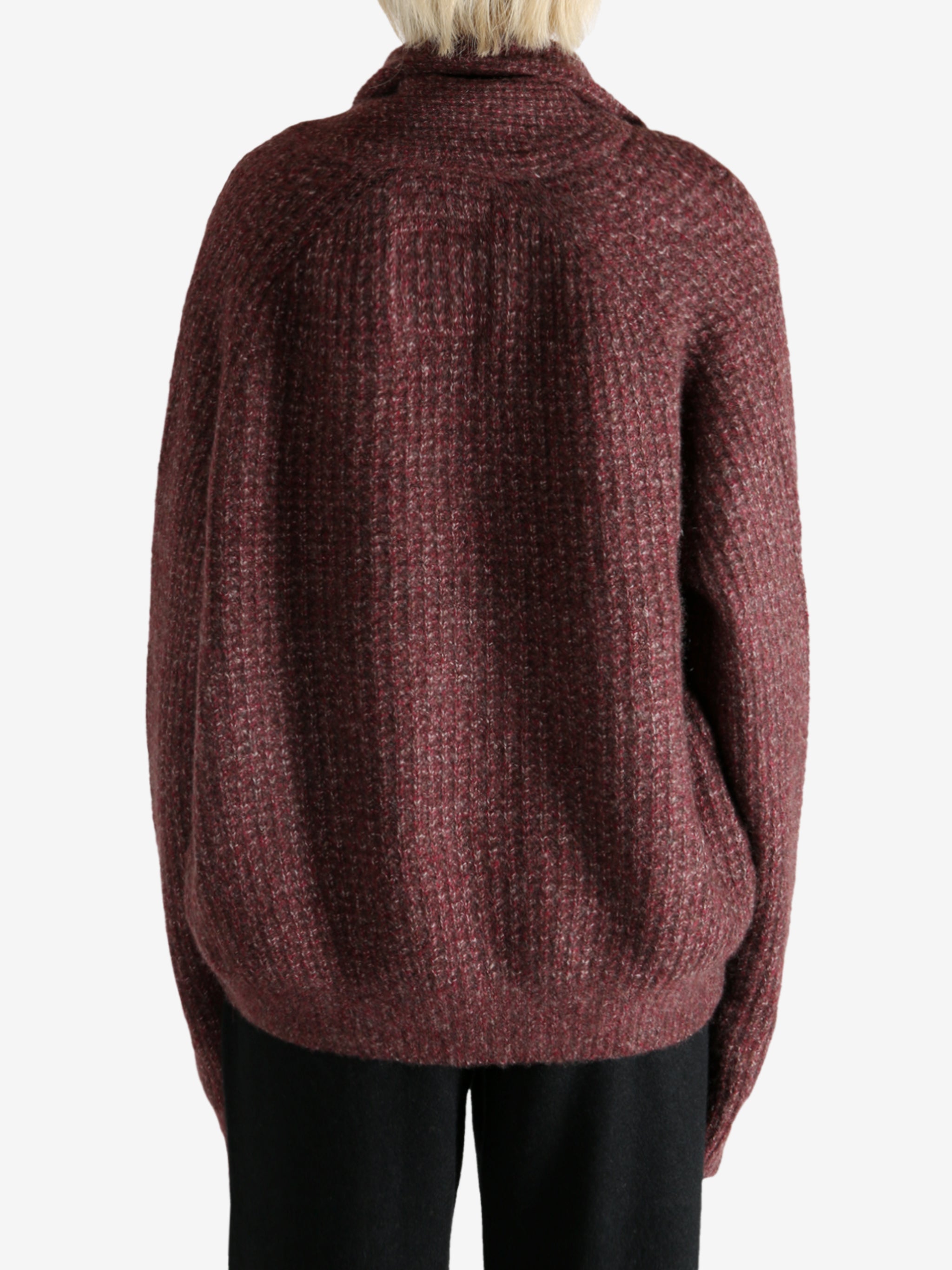 Red cardigan worn by a person, showing the cardigan's fit