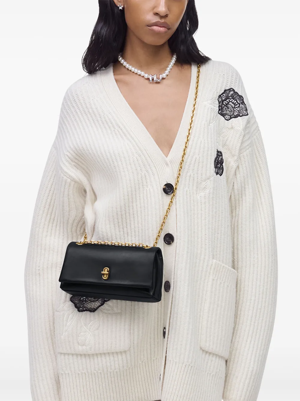 black bags worn by a person, showing the bags fit