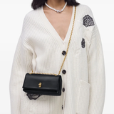 black bags worn by a person, showing the bags fit