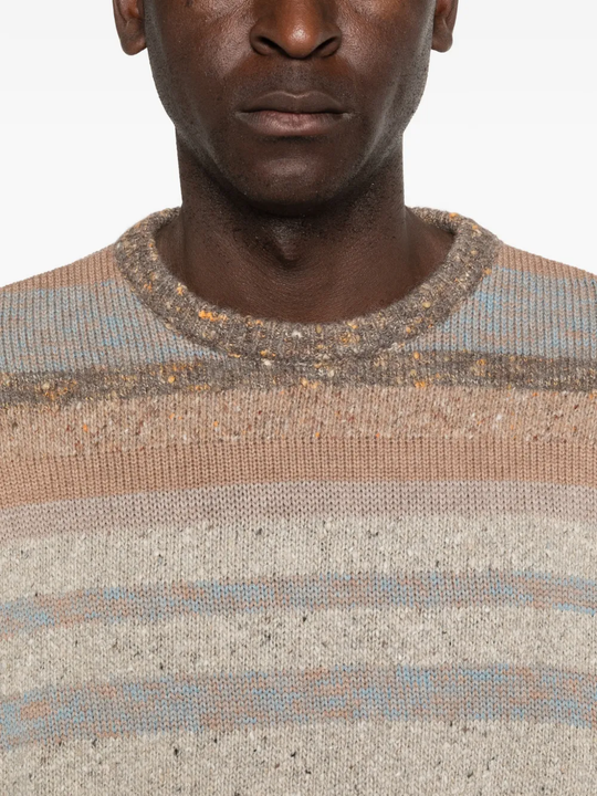 Close up of brown sweater, showing the detail of woll fabric