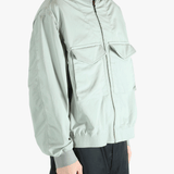 Grey jacket worn by a person, showing the jacket's fit