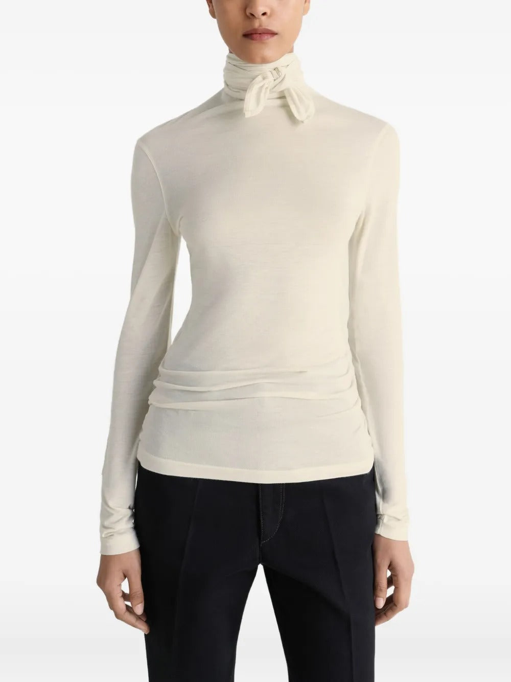 White top worn by a person, showing the top's fit