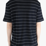 Navy t-shirt worn by a person, showing the t-shirt fit