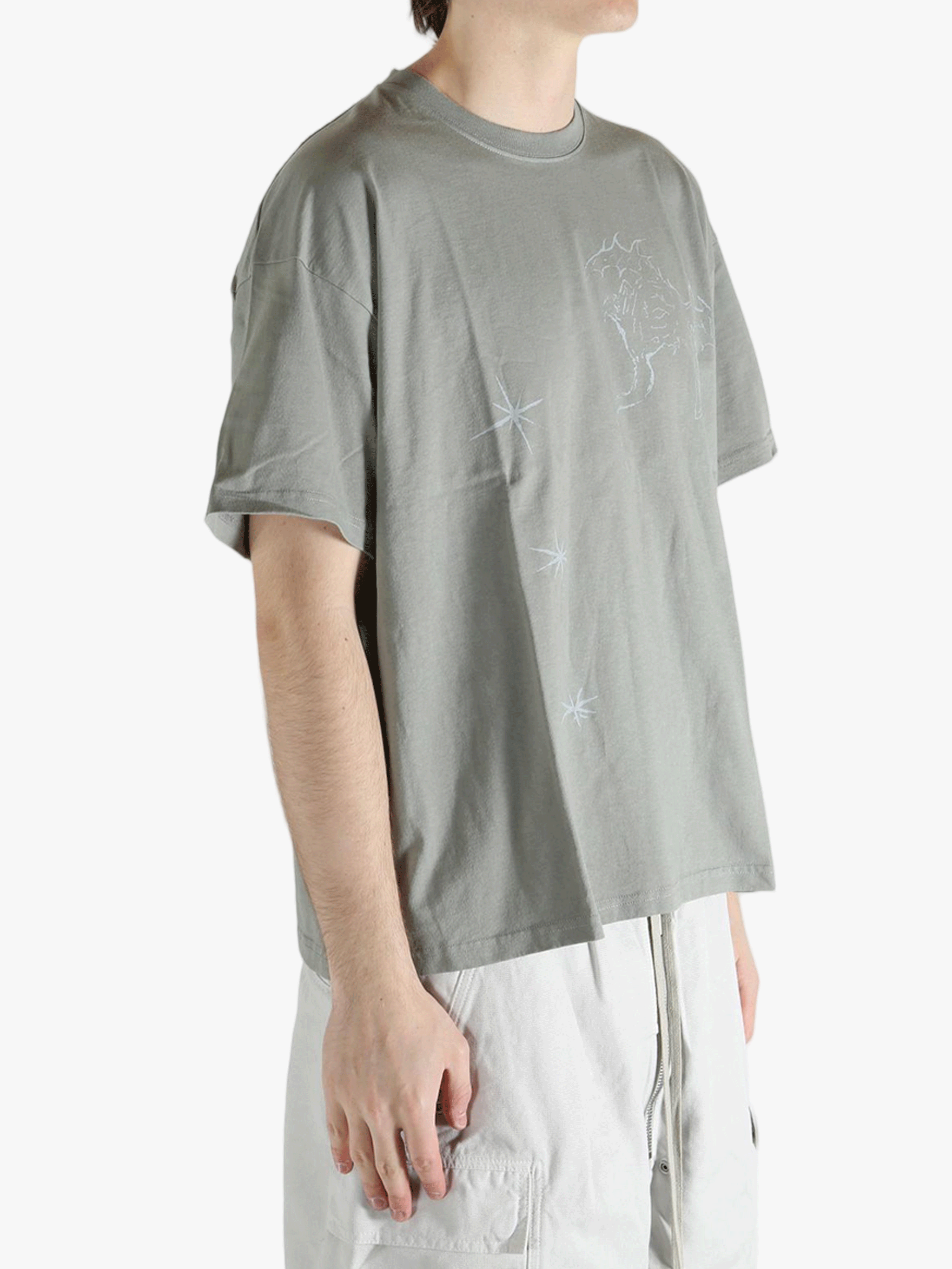 Grey t-shirt worn by a person, showing the shirt's fit