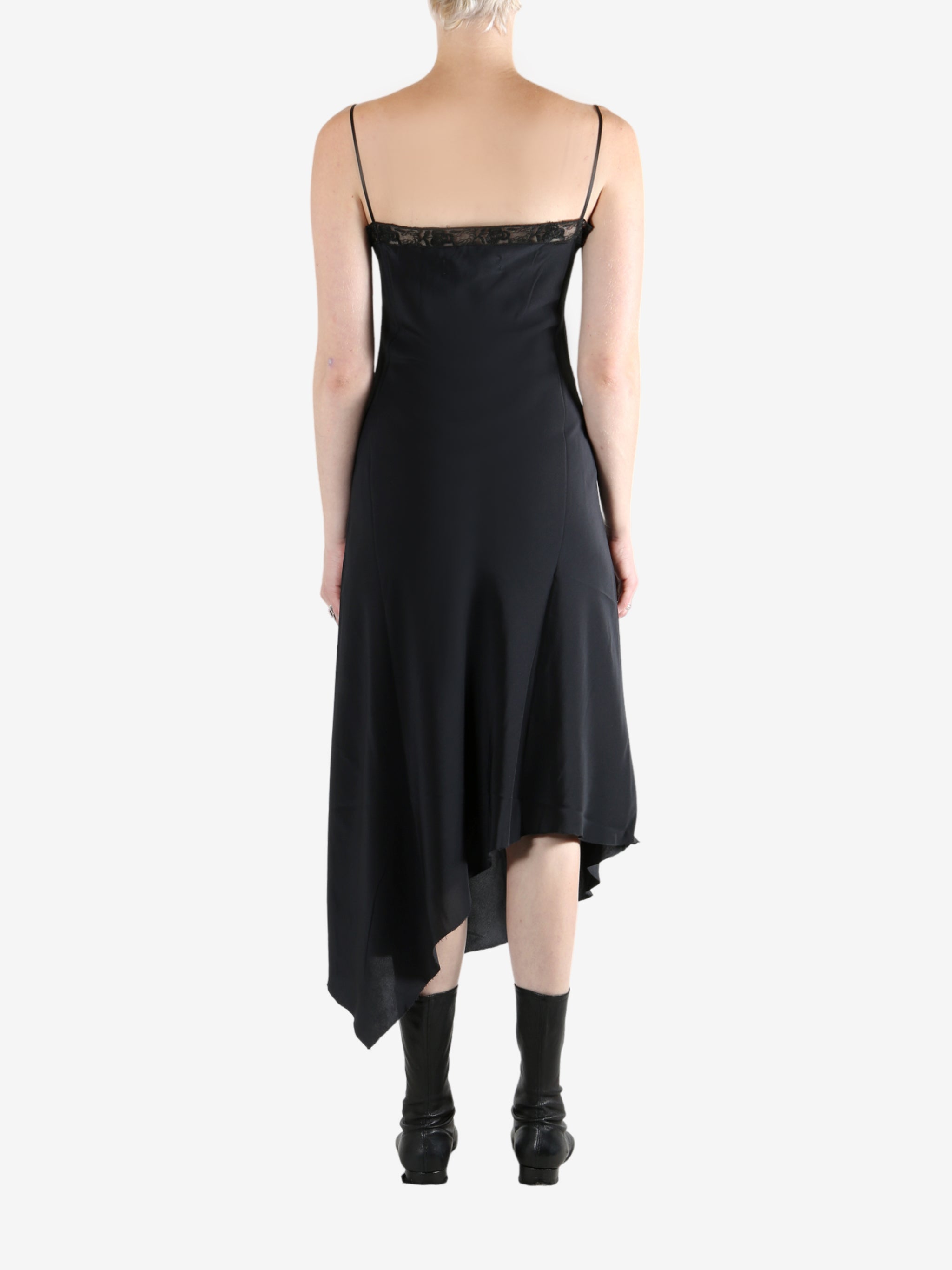 Black dress worn by a person, showing the dress's fit