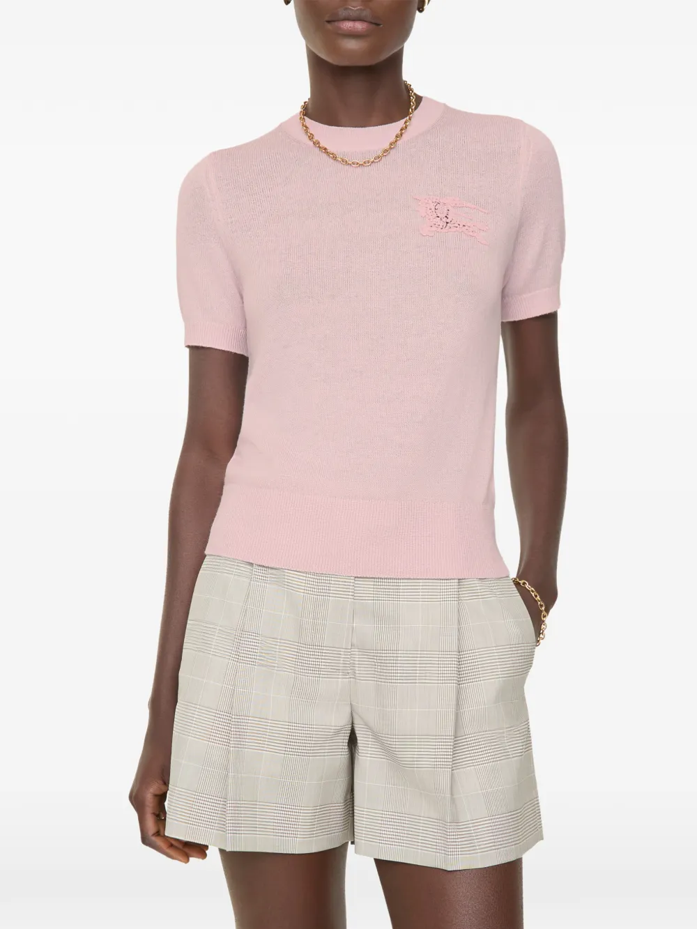 Pink tops worn by a person, showing the tops fit
