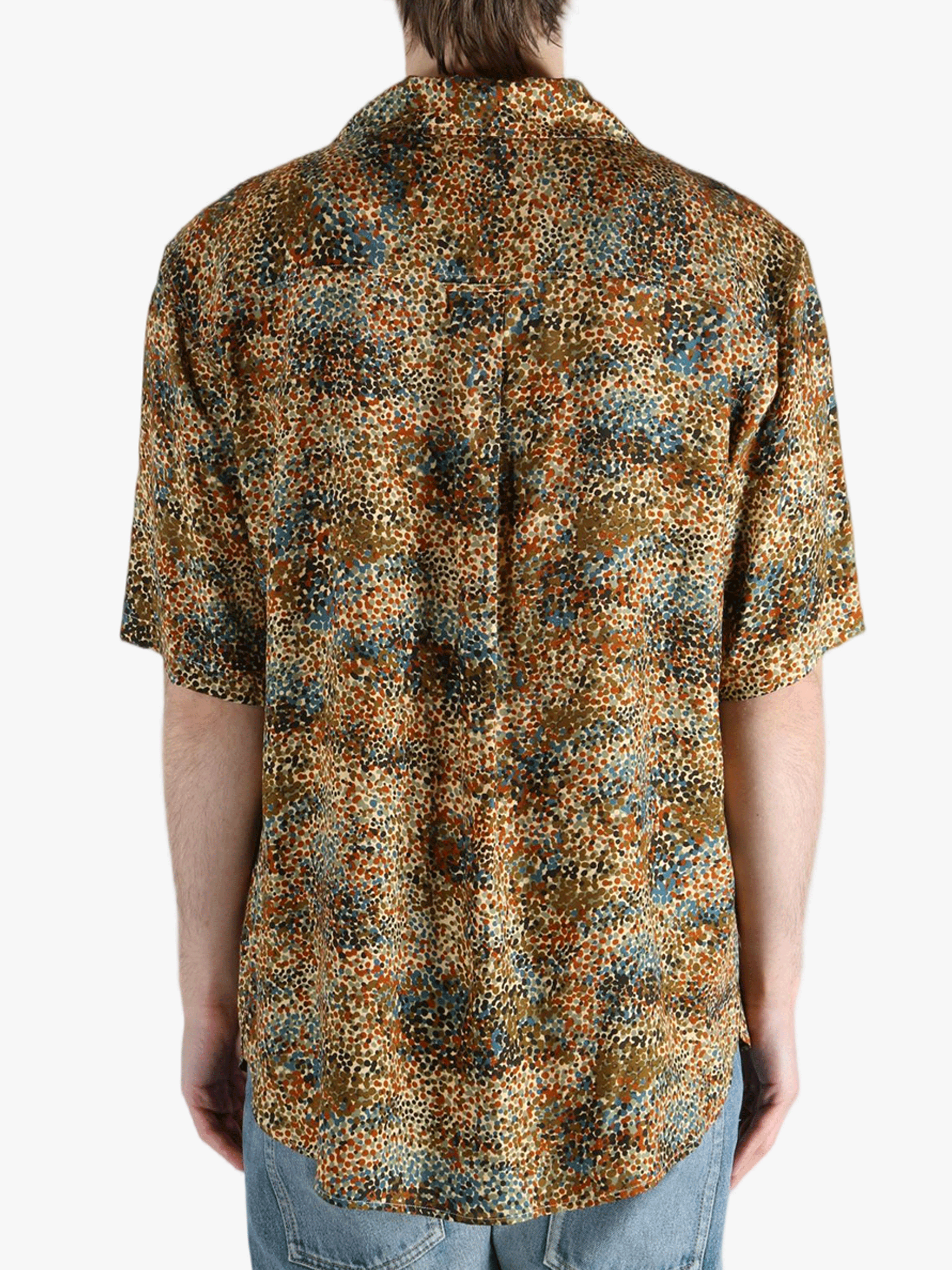 Tan shirt worn by a person, showing the fit