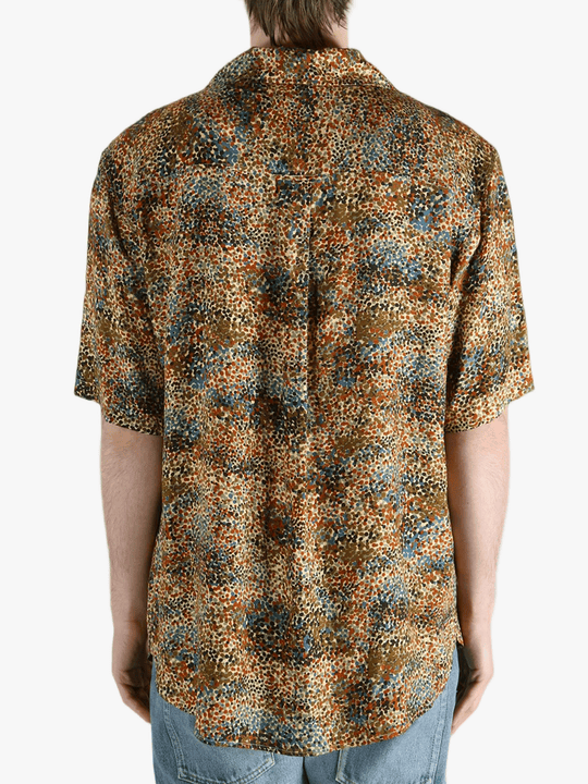 Tan shirt worn by a person, showing the fit