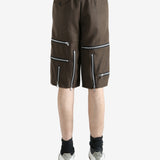 Brown shorts worn by a person, showing the shorts' fit