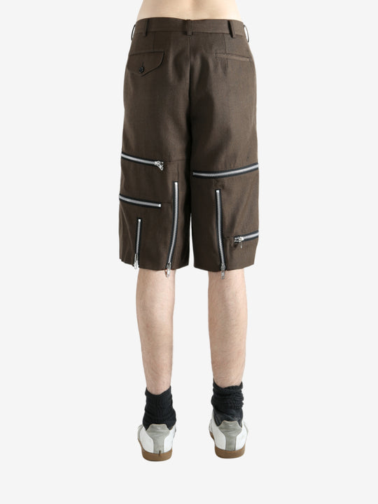 Brown shorts worn by a person, showing the shorts' fit