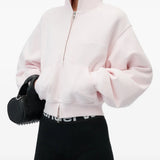 Pink hoodie worn by a person, showing the hoodie fit