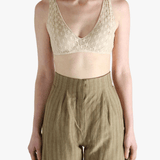 Tan bra worn by a person, showing the bra's fit