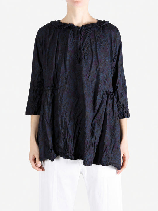 Navy shirt worn by a person, showing the shirt fit