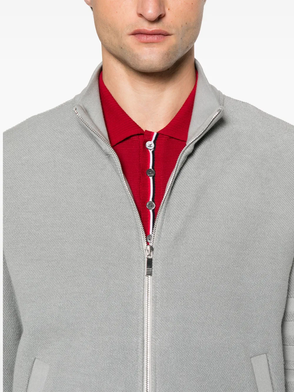 Close up of the grey jacket, showing texture of the cotton fabric