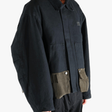 Black jacket worn by a person, showing the jacket's fit