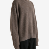 Brown knitwear worn by a person, showing the knitwear fit