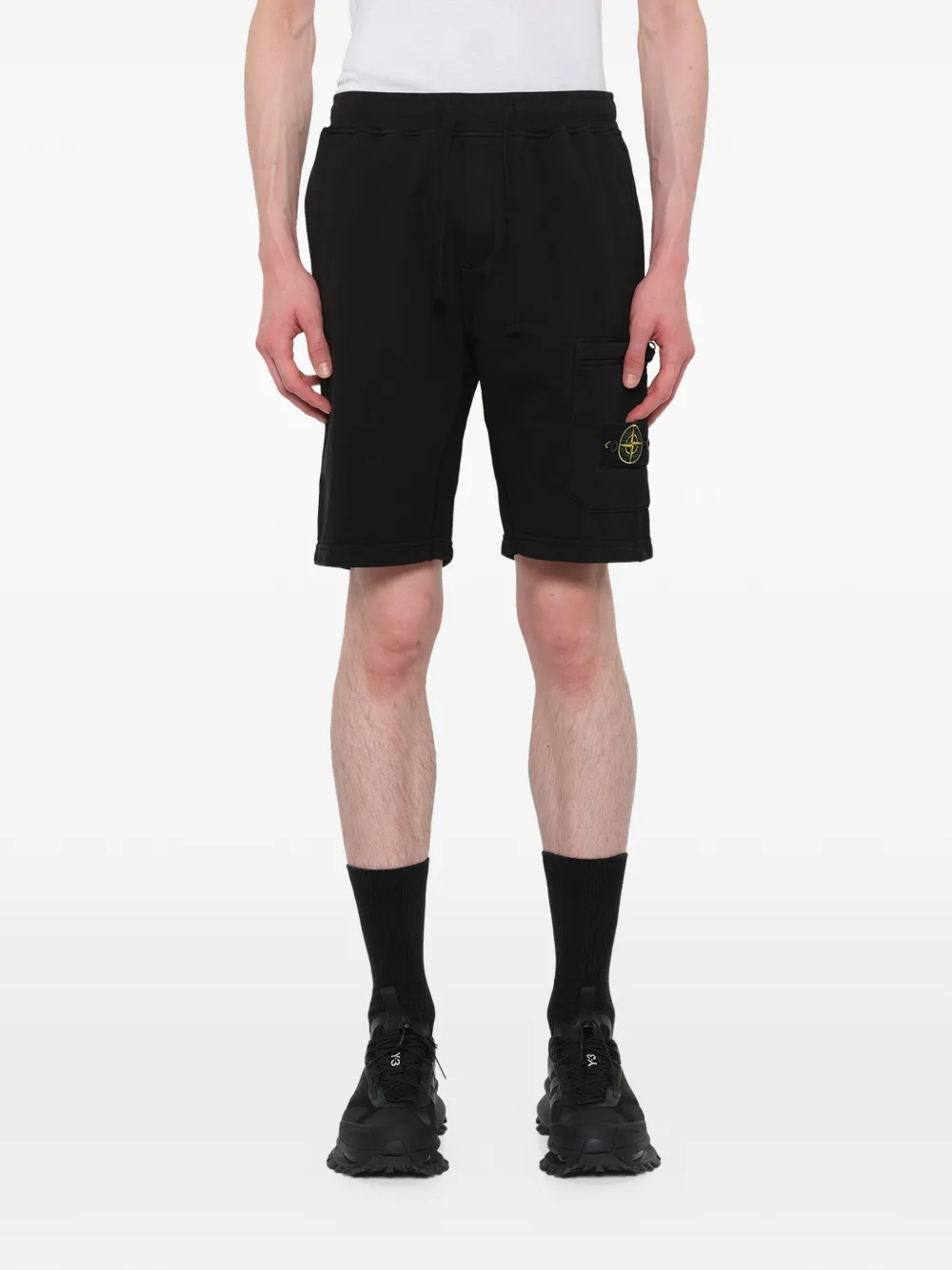 Black shorts warn a person,showing the shorts fit