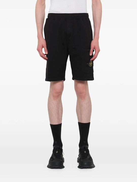 Black shorts warn a person,showing the shorts fit