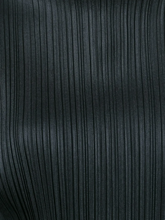 Close up of Black shirt, showing texture of the 100% polyester fabric