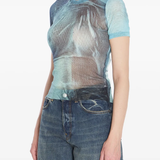 Blue t-shirt worn by a person, showing the shirt's fit