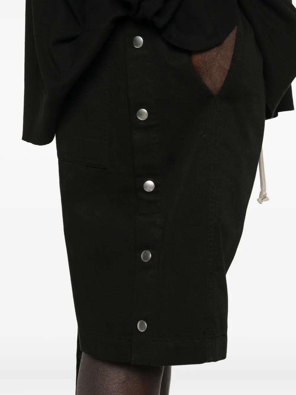 Close up of black shorts, showing texture of the shorts fabric