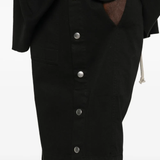 Close up of black shorts, showing texture of the shorts fabric