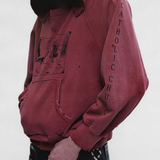 Burgundy hoodie worn by a person, showing the hoodie fit