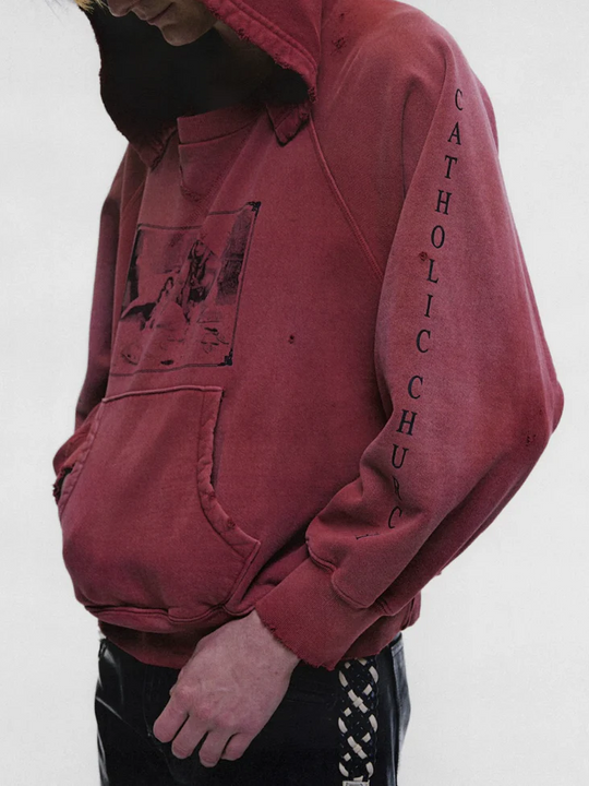 Burgundy hoodie worn by a person, showing the hoodie fit