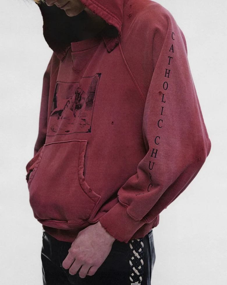 Burgundy hoodie worn by a person, showing the hoodie fit