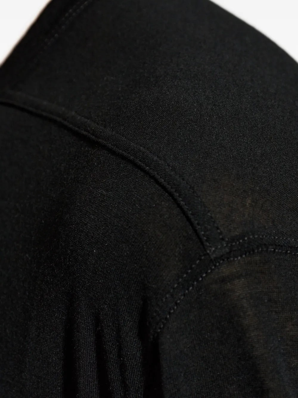 Close up of black t-shirts, showing texture of the viscose and silk fabric