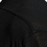 Close up of black t-shirts, showing texture of the viscose and silk fabric
