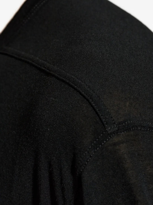Close up of black t-shirts, showing texture of the viscose and silk fabric
