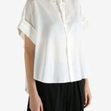 White shirts worn by a person, showing the shirts fit