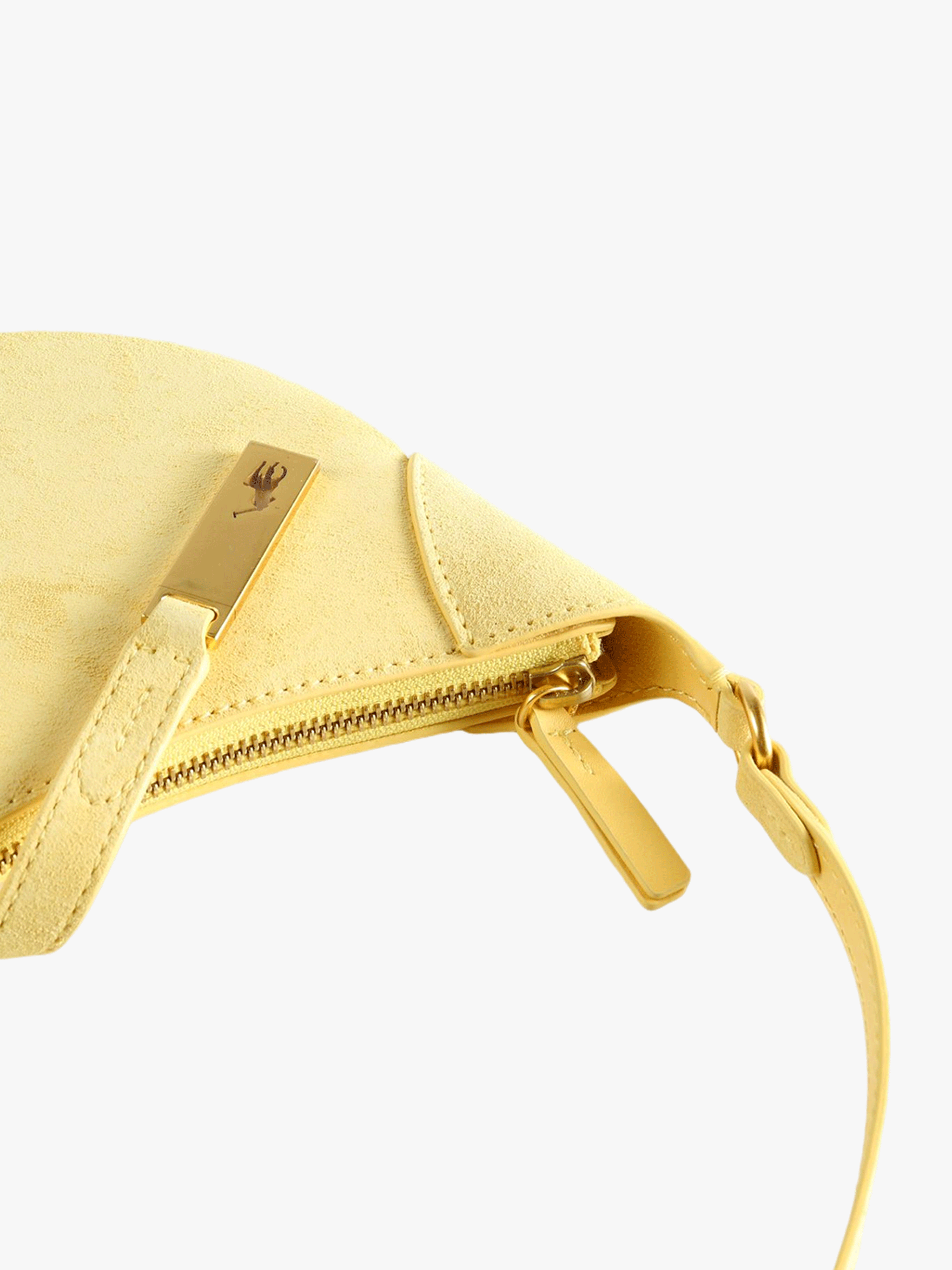 Cloes-up of yellow bag, showing texture of the leather bag