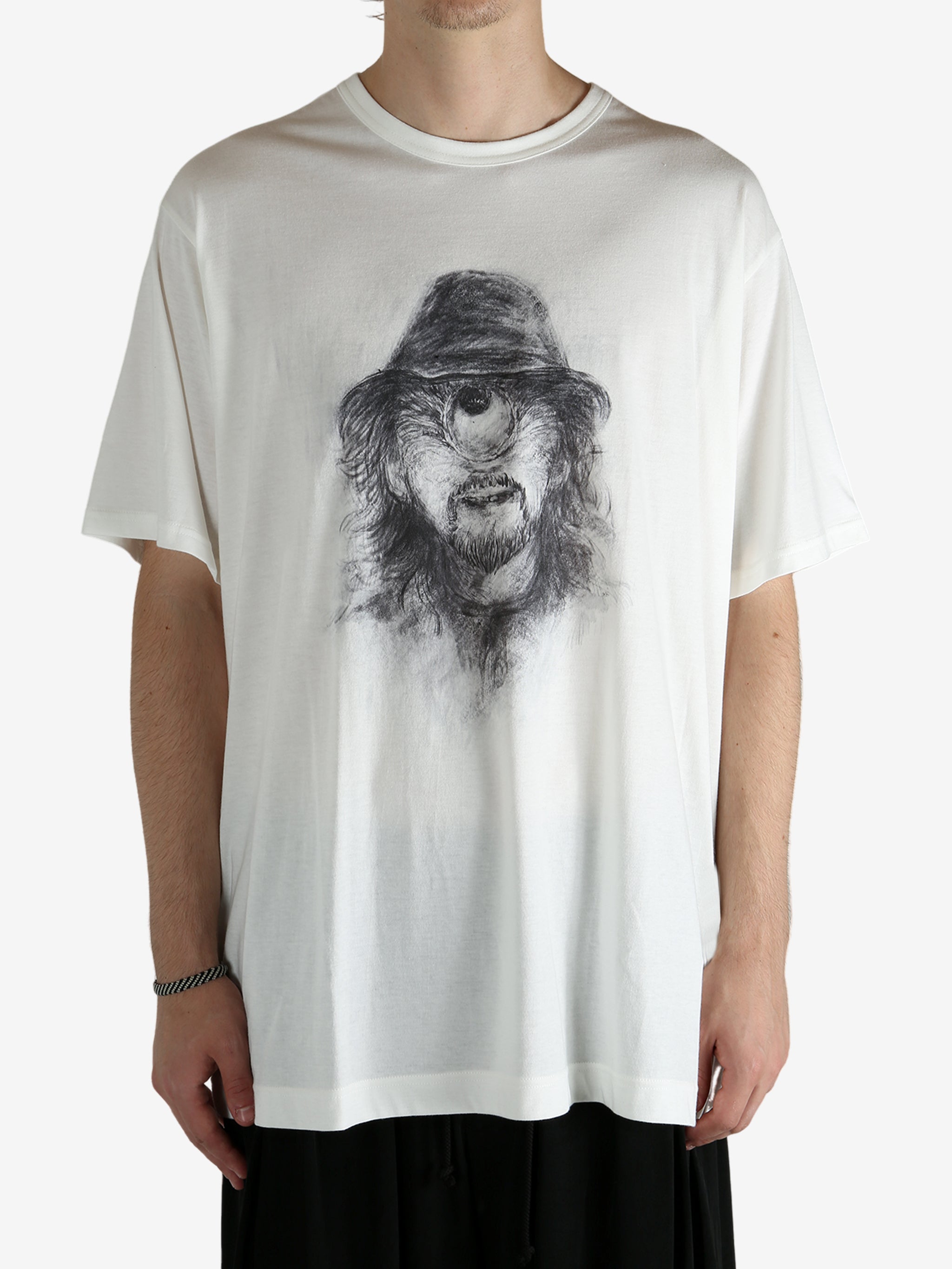 White t-shirt worn by a person, showing the shirt's fit