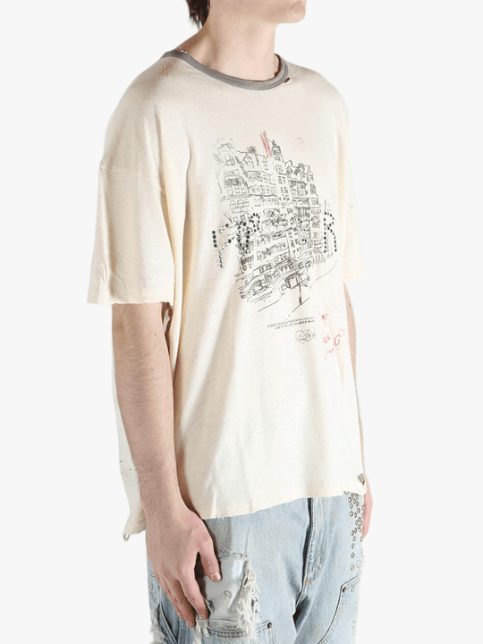 White t-shirt worn by a person, showing the shirt's fit