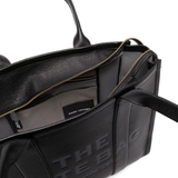 Close up of black bag, showing texture of the calf leather fabric