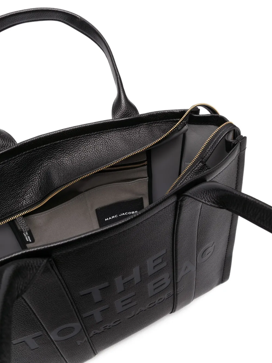 Close up of black bag, showing texture of the calf leather fabric