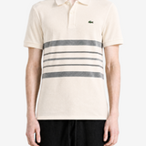 Tan shirt worn by a person, showing the shirt fit