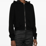 Black hoodie worn by a person, showing the hoodie's fit