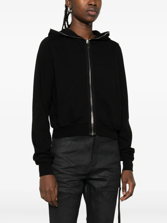Black hoodie worn by a person, showing the hoodie's fit