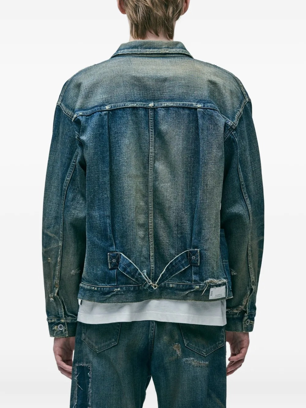 Blue jacket, worn by a person, showing the jacket's fit