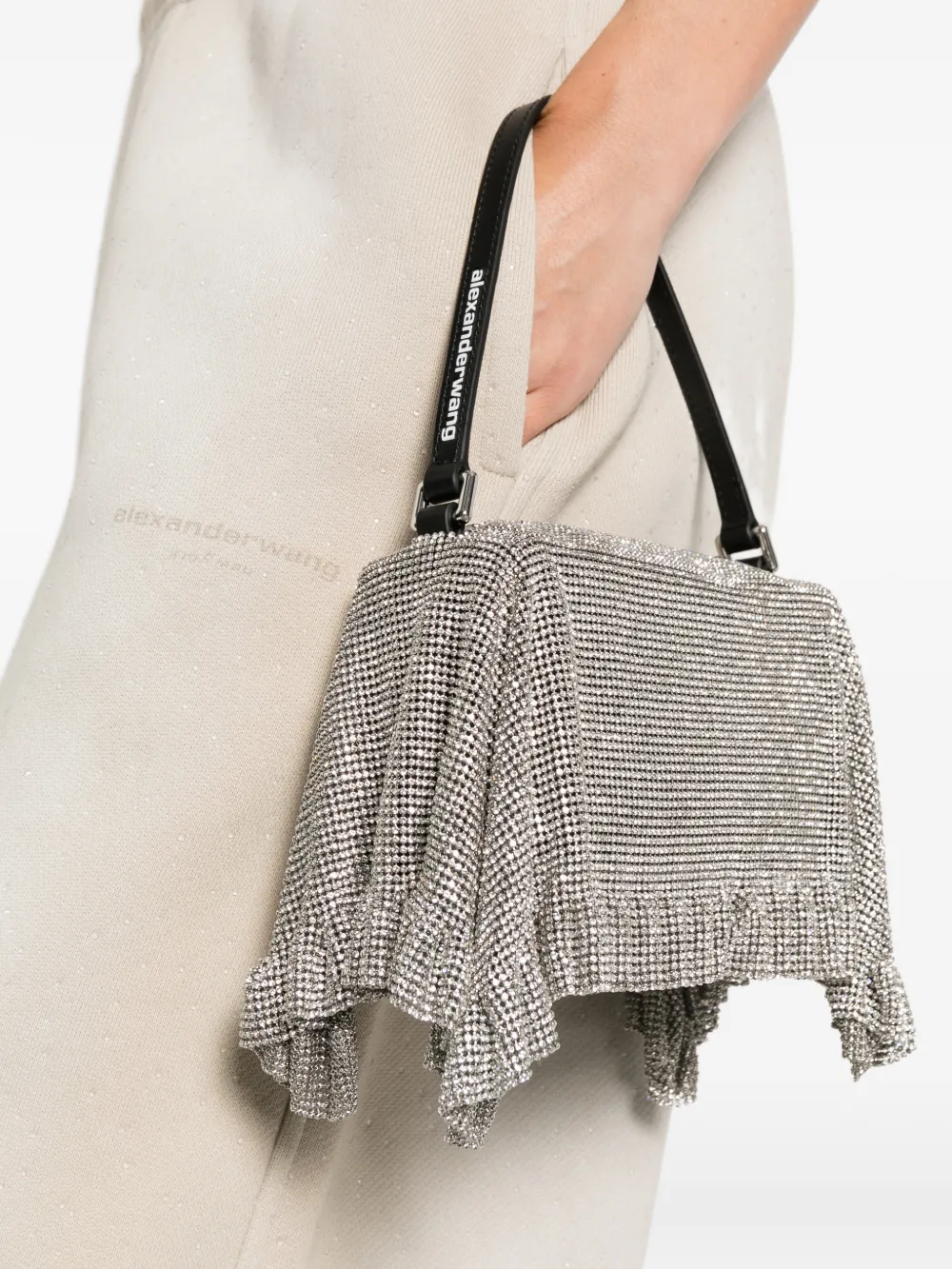 White bags worn by a person, showing the bags fit