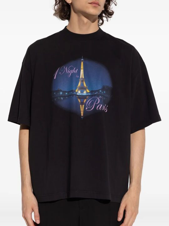 Black t-shirt worn by a person, showing the shirt's fit