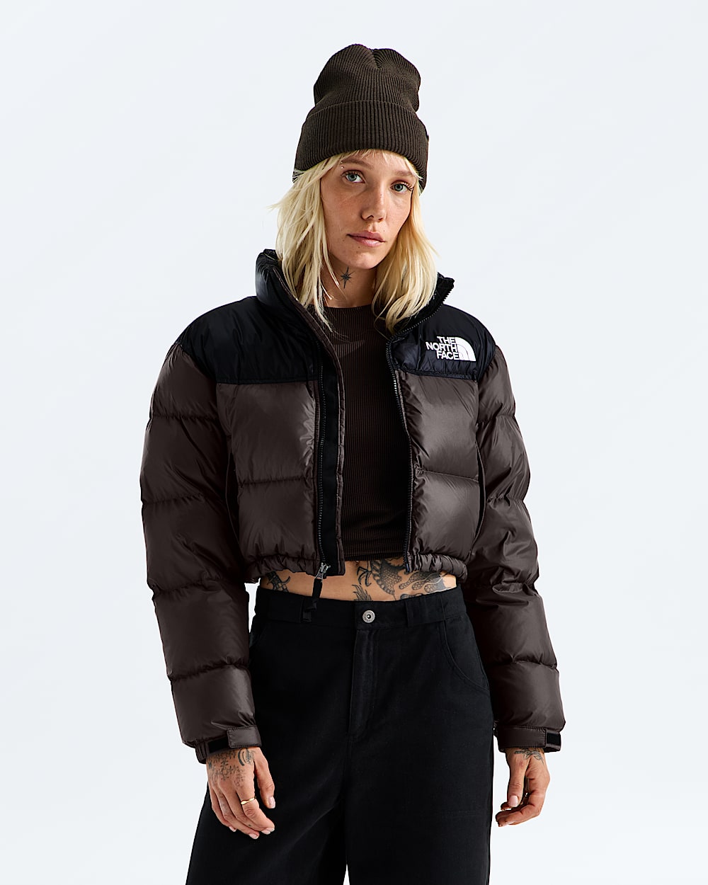 Brown jacket worn by a person, showing the jacket fit