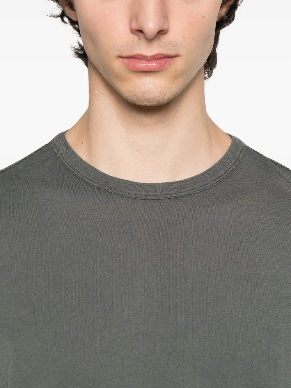 Close up of grey shirt, showing texture of the cotton fabric