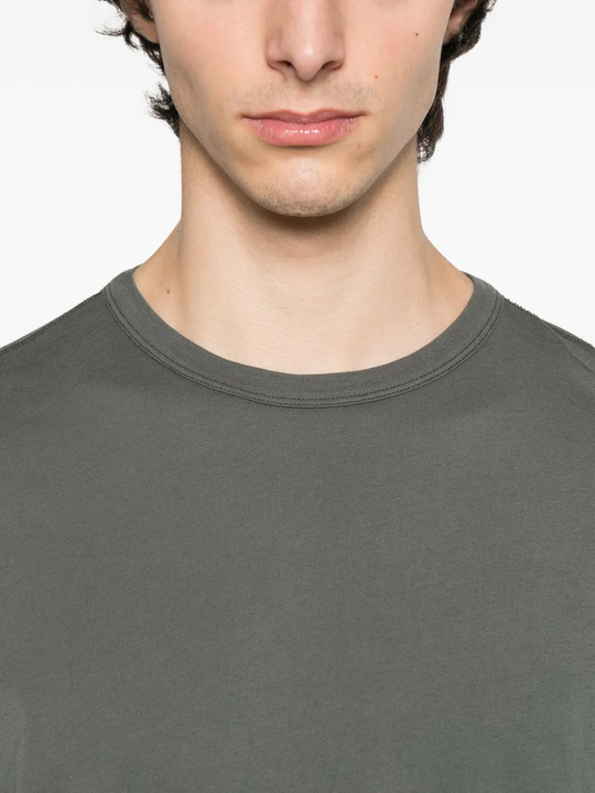 Close up of grey shirt, showing texture of the cotton fabric